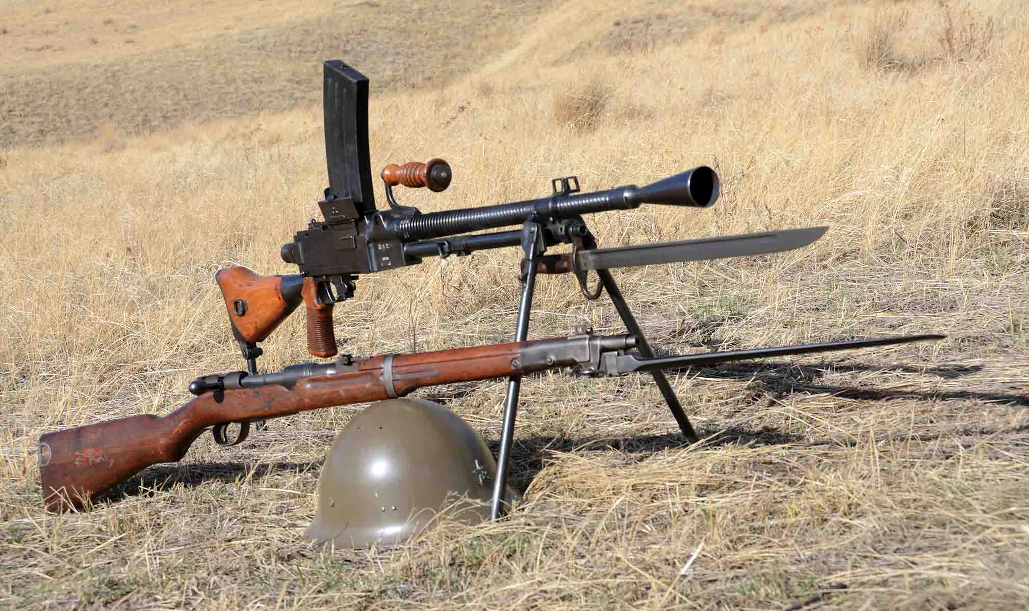 Members of crew-served weapons teams were often issued carbines. Shown is a Type 44 6.5mm carbine with a bayonet. The light machine gun is a Type 99 7.7mm that was also issued with a bayonet.